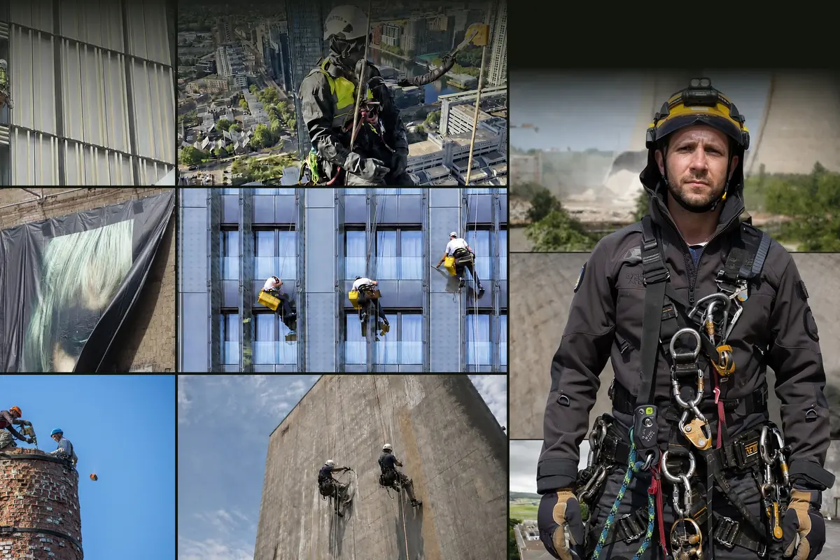 Alpinist utilitar echipat complet și echipe lucrând pe coardă pe fațade, mesh-uri și coșuri industriale